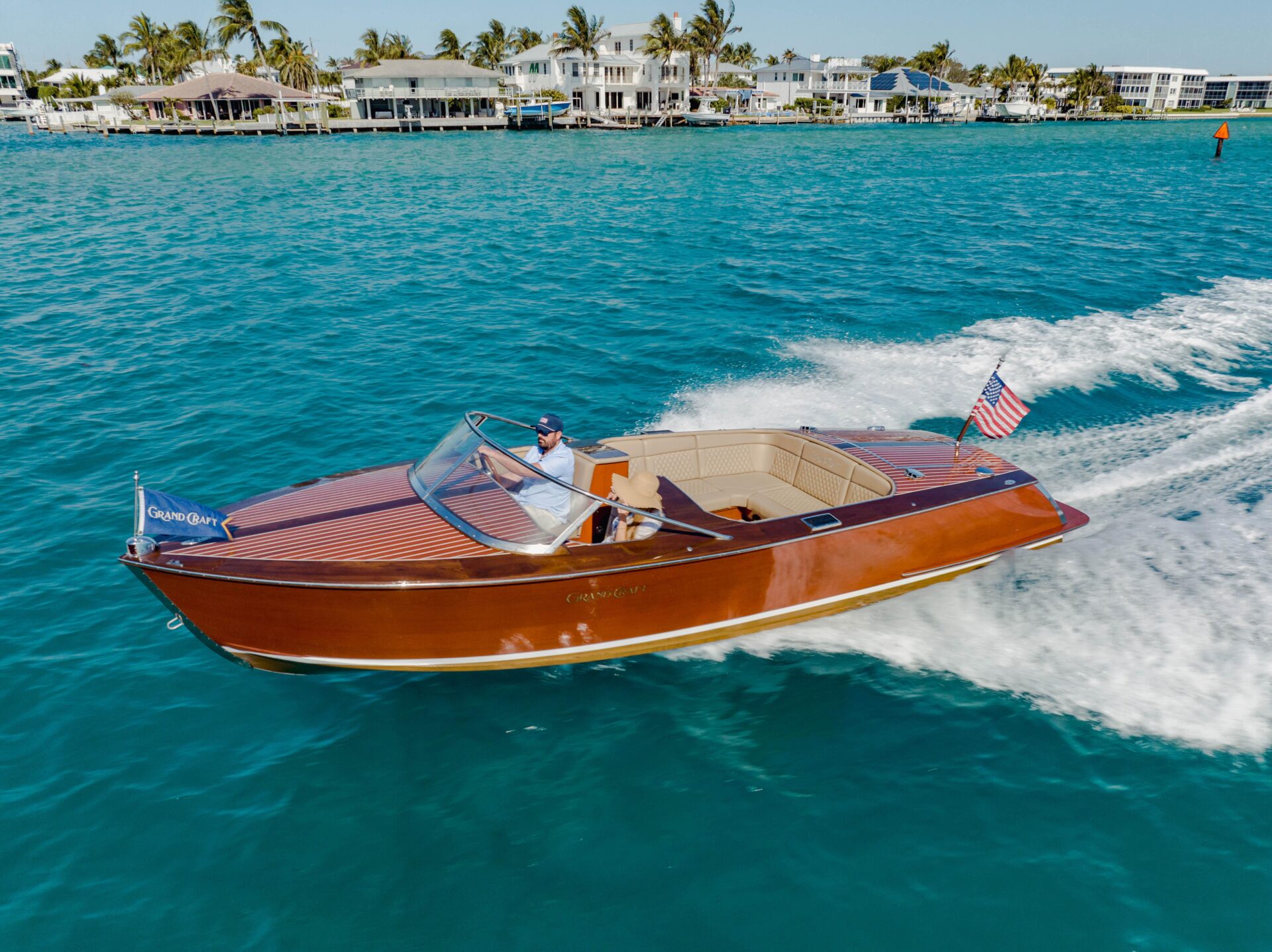 Classic mahogany runabout on Lake Bomoseen at golden hour